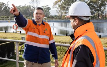 water services workers conversing